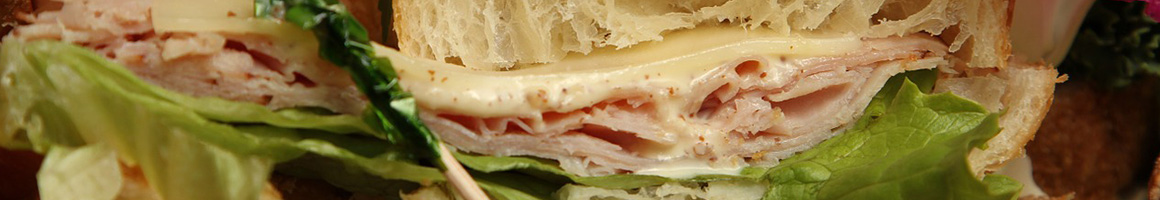 Eating Sandwich at Pino Gelato Cafe restaurant in Destin, FL.